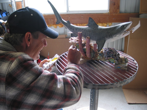 Bob working on the patina of a work in progress, The Tiger Shark
